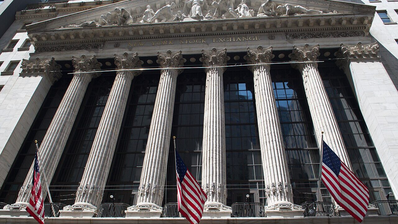 New York Stock Exchange facade with columns and flags