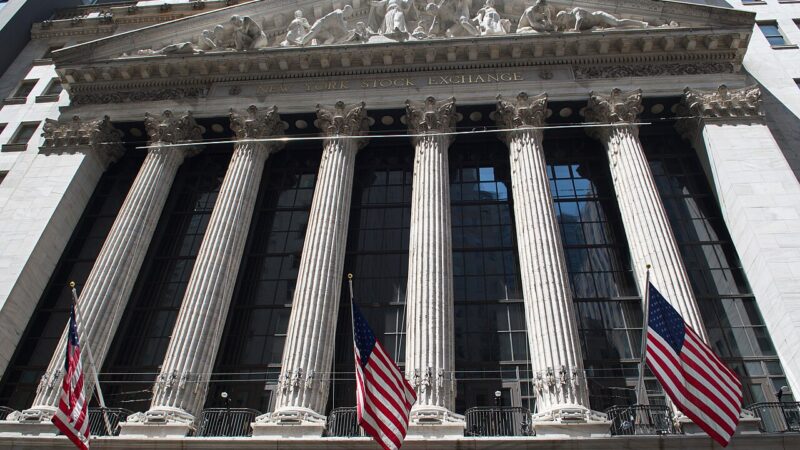 New York Stock Exchange facade with columns and flags