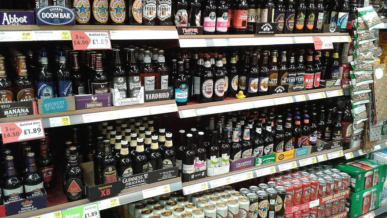 Supermarket shelves stocked with bottled drinks
