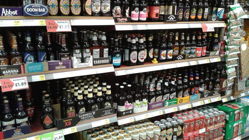 Supermarket shelves stocked with bottled drinks