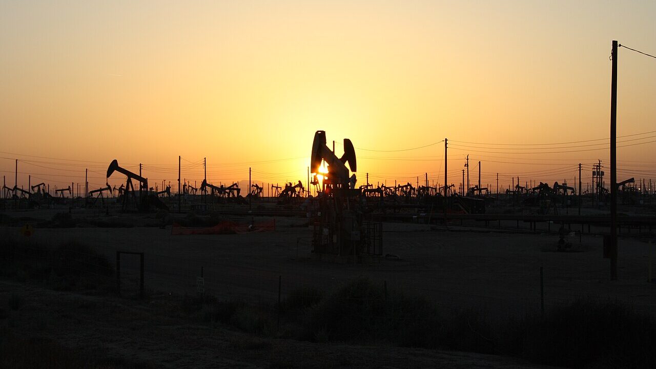 Oil pumpjacks silhouetted at sunset