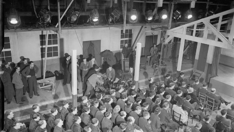 Black-and-white film production scene at Pinewood Studios