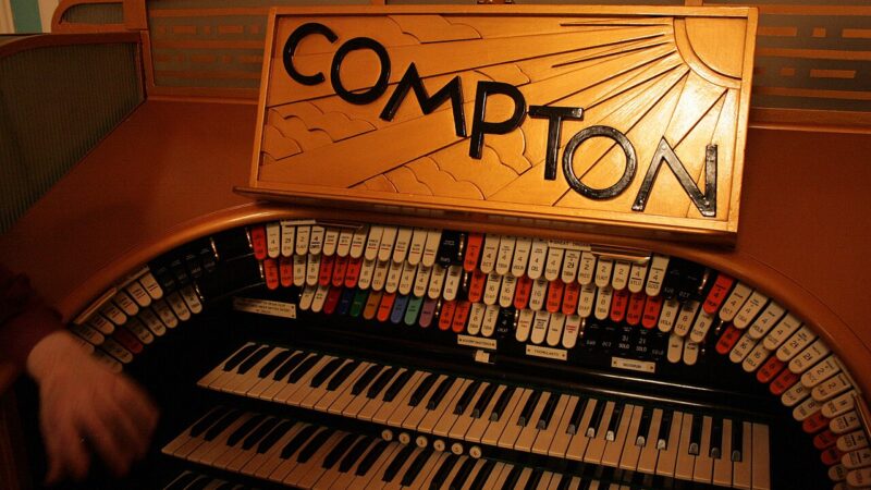Compton theatre organ console with illuminated sign