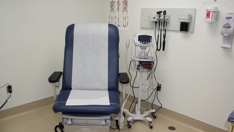 Ambulatory clinic examination room with couch and monitor