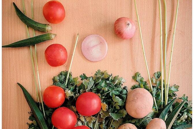 Bag of fresh vegetables and tomatoes from above