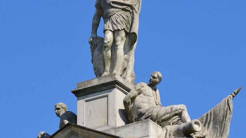 Palace sculpture of an armoured figure against blue sky