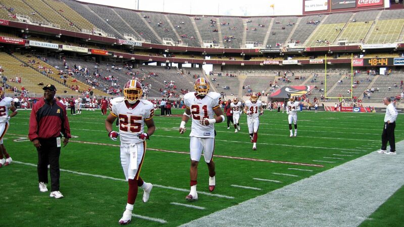 American football players on the field in a stadium
