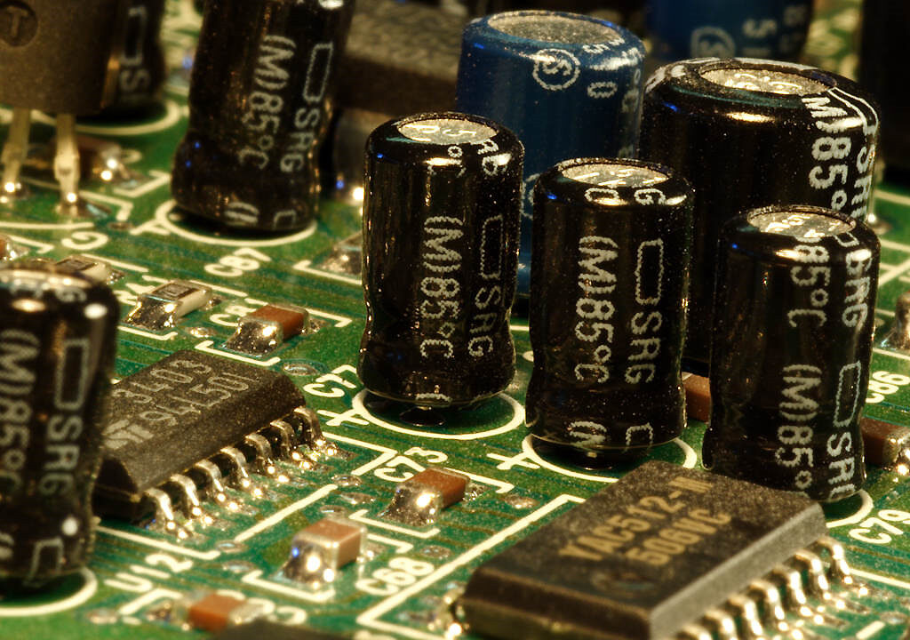 Macro view of capacitors and chips on a circuit board