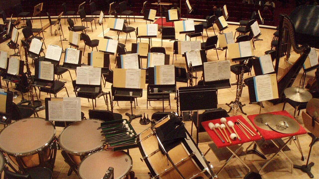 Orchestra instruments and music stands on a concert stage