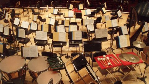 Orchestra instruments and music stands on a concert stage