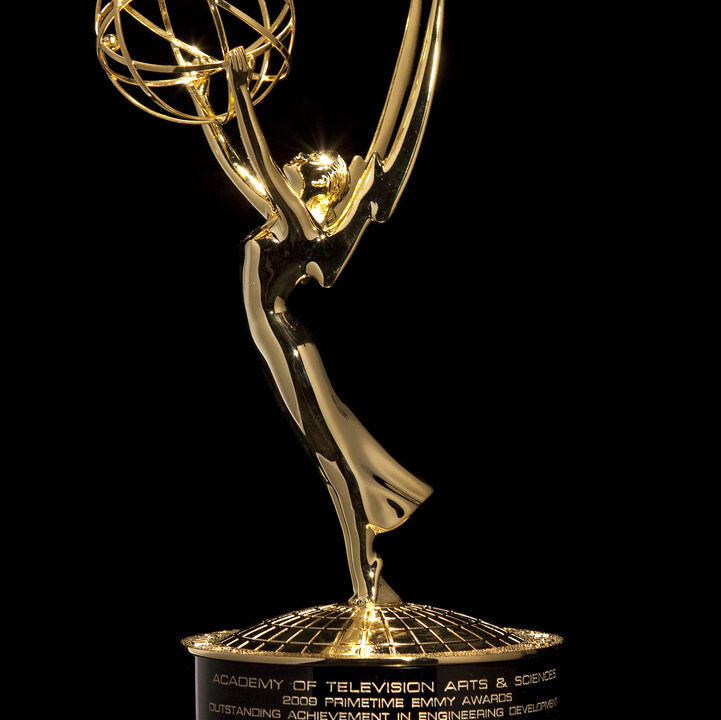 Gold Emmy Award statuette against a black background