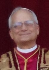 Pope Leo XIV smiling in papal vestments